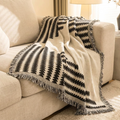 Eden sofa throw over the corner of a linen sofa in soft daylight