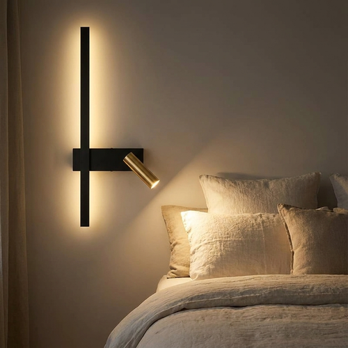 Melby wall light used as a reading light, warm light on a plaster wall