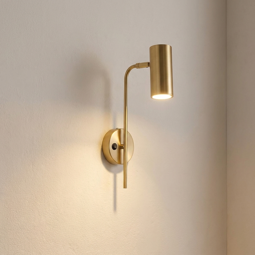 Alder iron wall sconce lit on a warm plaster interior wall