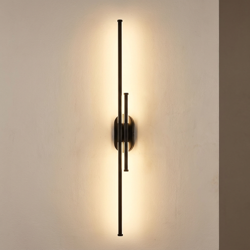 Quartz wall light casting a soft wash of light on a plaster wall