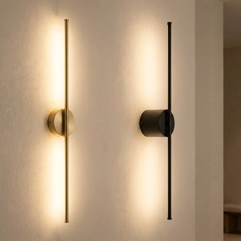 Nera wall light casting a soft wash of light on a plaster wall