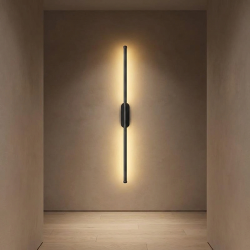 Quartz wall light in a hallway at night, warm light on the wall and oak floor