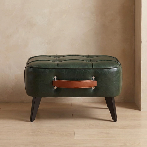 Aspen shoe bench against a plaster wall in an entryway on oak flooring