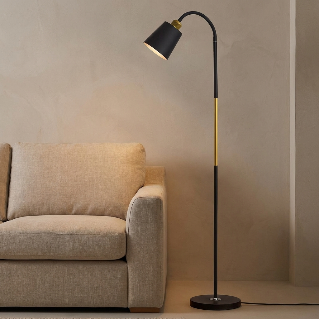 Furze iron floor lamp lit beside a linen sofa in a warm neutral living room