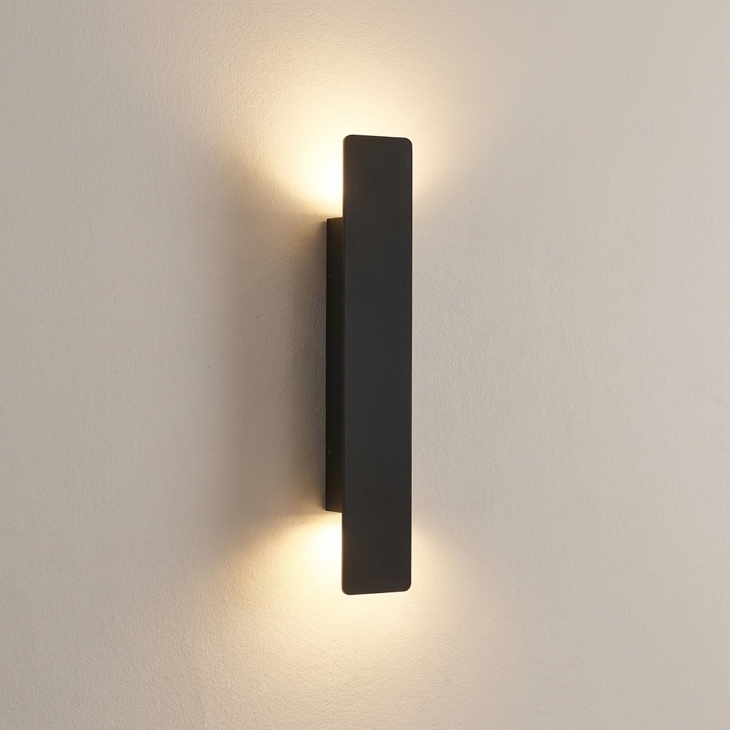 Torrin wall light casting a soft wash of light on a plaster wall