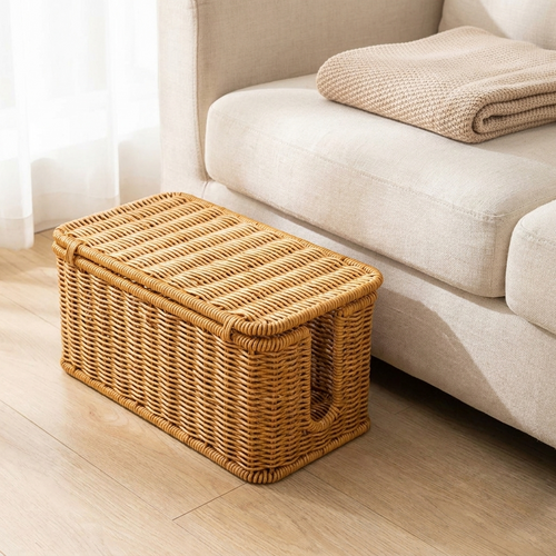 Tern storage basket beside a linen sofa holding a folded throw