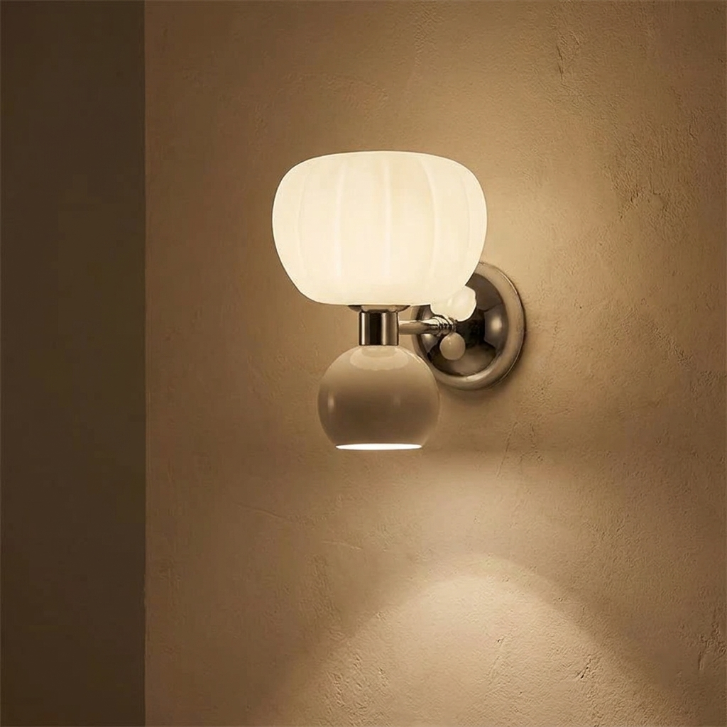 Rush wall light lit on a warm plaster interior wall