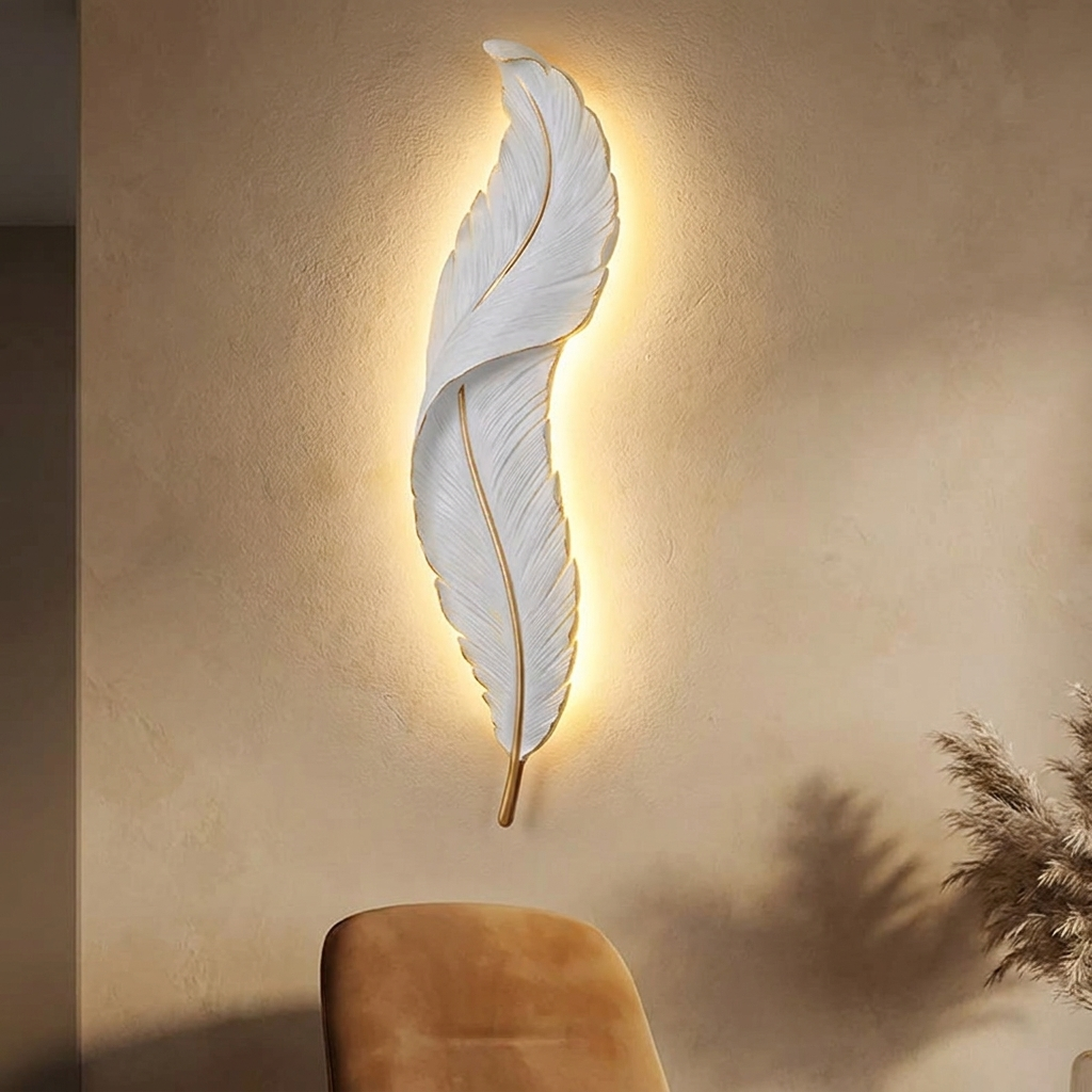 Pebble wall light casting a soft wash of light on a plaster wall
