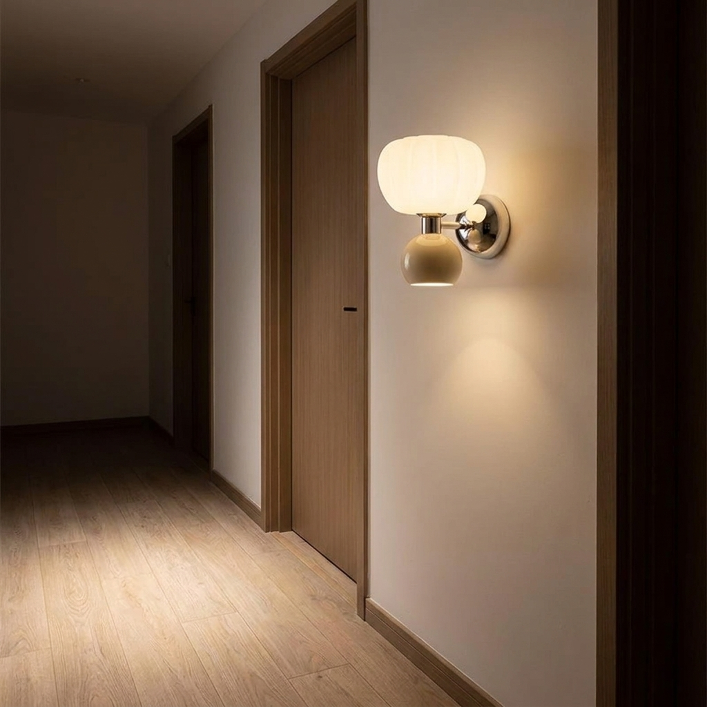 Rush wall light in a hallway at night above pale oak flooring